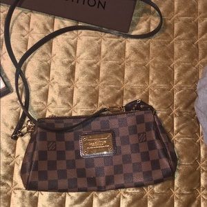 Eva damier ebene clutch with strap